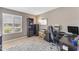 Home office with large window, built-in shelving, desk, and neutral-toned walls at 928 W Natal Ave, Mesa, AZ 85210