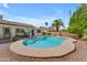 Inviting backyard pool with lounge chairs, covered patio, and lush landscaping at 928 W Natal Ave, Mesa, AZ 85210
