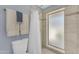 Well-lit shower room with white shower curtain, tiled walls, and modern fixtures at 928 W Natal Ave, Mesa, AZ 85210