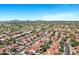 Stunning aerial view of a well-maintained neighborhood showcasing tree-lined streets, pools, and lush green spaces at 10102 E Dreyfus Ave, Scottsdale, AZ 85260