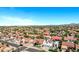 Sweeping aerial view displaying a dense residential area filled with houses featuring iconic red tile roofs at 10102 E Dreyfus Ave, Scottsdale, AZ 85260