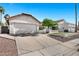 Single-Gathering home with a two-car garage and low maintenance desert landscaping at 10102 E Dreyfus Ave, Scottsdale, AZ 85260