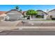 Charming single-Gathering home featuring a well-manicured lawn and a two-car garage at 10102 E Dreyfus Ave, Scottsdale, AZ 85260