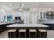 Kitchen features a large island with seating and modern light fixtures at 10102 E Dreyfus Ave, Scottsdale, AZ 85260