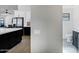 View of kitchen and powder room with white walls and stainless steel appliances at 10102 E Dreyfus Ave, Scottsdale, AZ 85260