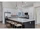 Gourmet kitchen with stainless steel appliances, and expansive island with seating at 10102 E Dreyfus Ave, Scottsdale, AZ 85260