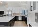 Well-appointed kitchen with custom cabinetry, stainless steel appliances, and a spacious island at 10102 E Dreyfus Ave, Scottsdale, AZ 85260