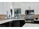 Gourmet kitchen featuring stone backsplash, ample countertop space, and stylish fixtures at 10102 E Dreyfus Ave, Scottsdale, AZ 85260