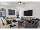 Open living room with a vaulted ceiling, modern furniture, and an entertainment center at 10102 E Dreyfus Ave, Scottsdale, AZ 85260