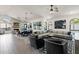 Bright and airy living room with an open floor plan, tile floors, and modern furnishings at 10102 E Dreyfus Ave, Scottsdale, AZ 85260