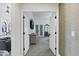 View of the main bedroom featuring double doors that lead to a ensuite bathroom at 10102 E Dreyfus Ave, Scottsdale, AZ 85260