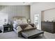 Comfortable main bedroom with a plush bed, accent wall, and inviting ambiance at 10102 E Dreyfus Ave, Scottsdale, AZ 85260