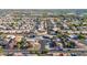 Wide aerial shot of a residential neighborhood featuring lush greenery and community spaces at 1057 S 74Th St, Mesa, AZ 85208