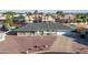 Inviting single-story home with desert landscaping, gray roof and a two-car garage in residential neighborhood at 1057 S 74Th St, Mesa, AZ 85208