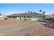 Inviting single-story home boasts well-maintained landscaping, a spacious driveway, and a two-car garage at 1057 S 74Th St, Mesa, AZ 85208