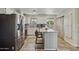 Bright kitchen featuring white cabinets, granite countertops, stainless steel appliances, and a center island at 1057 S 74Th St, Mesa, AZ 85208