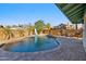 Wide shot of backyard pool showcasing curved design, slide, and tiled patio for entertaining and relaxation at 1057 S 74Th St, Mesa, AZ 85208