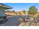 Backyard pool with surrounding stone patio, outdoor seating, and lush greenery, creating a private oasis at 1057 S 74Th St, Mesa, AZ 85208