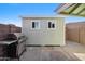 Shed in the backyard with grill, offering ample storage space and functional outdoor living at 1057 S 74Th St, Mesa, AZ 85208