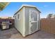Backyard storage shed with double door, grill, providing ample storage and convenient access to outdoor tools at 1057 S 74Th St, Mesa, AZ 85208