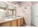 Bright bathroom with double sinks, vanity, large mirror, and well-lit vanity area at 1138 E Avenida Isabela St, Casa Grande, AZ 85122