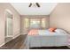 Comfortable bedroom with a bay window providing natural light and hardwood floors at 1138 E Avenida Isabela St, Casa Grande, AZ 85122