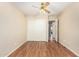 Bedroom showcasing wood floors, a ceiling fan, a closet, and an adjacent doorway at 1138 E Avenida Isabela St, Casa Grande, AZ 85122