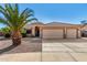 Charming home with a tile roof, low maintenance landscaping and a convenient two car garage at 1138 E Avenida Isabela St, Casa Grande, AZ 85122