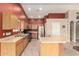 Spacious kitchen with stainless steel appliances, center island, and tile flooring at 1138 E Avenida Isabela St, Casa Grande, AZ 85122