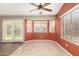Cozy living room with tiled floor, bay windows, ceiling fan and sliding glass doors to backyard at 1138 E Avenida Isabela St, Casa Grande, AZ 85122