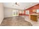 Open concept featuring tile floor, breakfast bar, ceiling fans, with backyard access at 1138 E Avenida Isabela St, Casa Grande, AZ 85122
