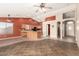 Inviting open-concept living room flowing into a modern kitchen with an island and breakfast bar at 1138 E Avenida Isabela St, Casa Grande, AZ 85122