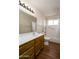 Clean bathroom featuring a vanity, toilet, and shower-tub combination at 11447 E Mendoza Ave, Mesa, AZ 85209