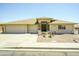 Charming single-story home featuring a three-car garage and desert landscaping for low maintenance appeal at 11447 E Mendoza Ave, Mesa, AZ 85209