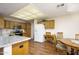 Kitchen featuring an eat-in area, wood cabinets, granite counters and stainless appliances at 11447 E Mendoza Ave, Mesa, AZ 85209