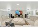 Finished basement featuring a large entertainment center and comfortable seating at 1160 E Cedar Pl, Chandler, AZ 85249