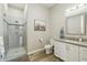 Updated bathroom features a walk-in shower, tile floors, and a sleek modern vanity at 1160 E Cedar Pl, Chandler, AZ 85249