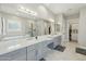 Bright bathroom boasts dual sinks, a makeup vanity, soaking tub, and walk-in shower at 1160 E Cedar Pl, Chandler, AZ 85249