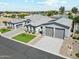 Stunning home featuring a three-car garage, complemented by professional landscaping and a stylish paver driveway at 1160 E Cedar Pl, Chandler, AZ 85249