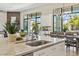 Bright, modern kitchen features a marble island, stainless steel faucet, and backyard view at 1160 E Cedar Pl, Chandler, AZ 85249