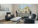 Cozy sitting area features two chairs, a gray coffee table, textured rug and a decorative cabinet at 1160 E Cedar Pl, Chandler, AZ 85249