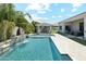 Beautiful backyard pool with a water feature and a covered outdoor dining area at 1160 E Cedar Pl, Chandler, AZ 85249
