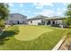 Backyard putting green and outdoor kitchen area with dining, perfect for relaxation and fun at 1160 E Cedar Pl, Chandler, AZ 85249
