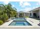 Beautiful backyard pool and spa with a covered patio including an outdoor dining area, perfect for entertaining and relaxing at 1160 E Cedar Pl, Chandler, AZ 85249
