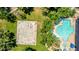 Aerial view of basketball court and community pool surrounded by mature landscaping and lounge seating at 14870 W Encanto Blvd # 2138, Goodyear, AZ 85395