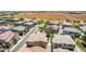 An aerial view showcasing a neighborhood including a playground, sidewalks and lush landscaping at 14870 W Encanto Blvd # 2138, Goodyear, AZ 85395