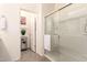 Well-lit bathroom with a double vanity, framed mirrors, stylish fixtures and a glass shower stall at 14870 W Encanto Blvd # 2138, Goodyear, AZ 85395