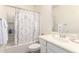Bathroom with a shower-tub, vanity, and decorative shower curtain at 14870 W Encanto Blvd # 2138, Goodyear, AZ 85395