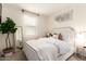 Bright bedroom with a large window, elegant decor, and a full-length mirror at 14870 W Encanto Blvd # 2138, Goodyear, AZ 85395