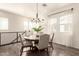 Charming dining area featuring a stylish chandelier and hardwood floors, perfect for gatherings at 14870 W Encanto Blvd # 2138, Goodyear, AZ 85395